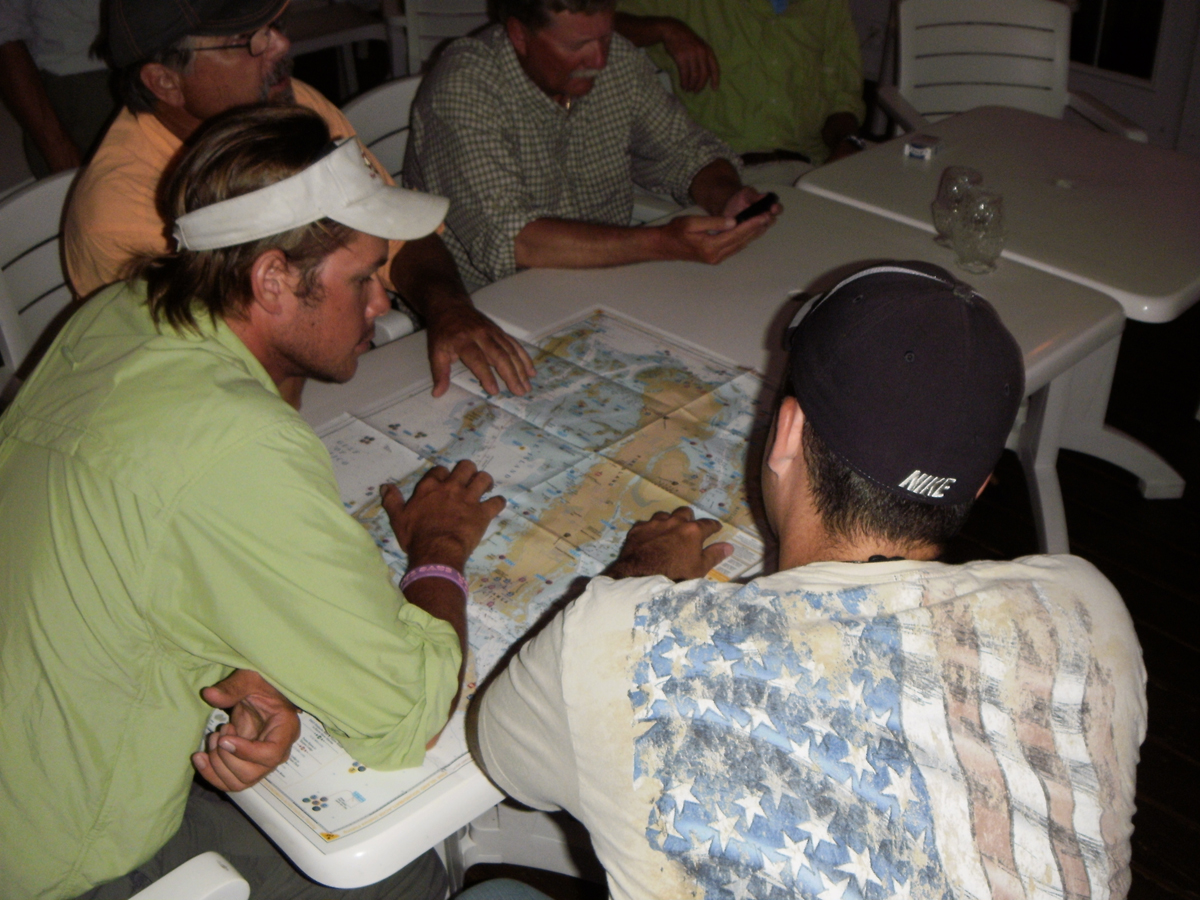 Kayak anglers comparing prospective fishing areas.