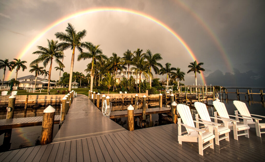 Beautiful Tarpon Lodge after a sunset storm encircled by a double rainbow.