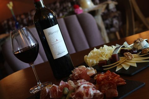 Massaya wine on table with cheese