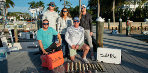 Team Salt Life poses for a photo on the dock at Tarpon Lodge